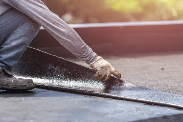 Professional Basement Waterproofing technician working in Columbia, IL